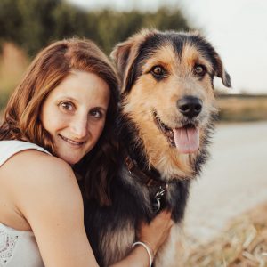 dog with owner, photoshooot in a cornfield